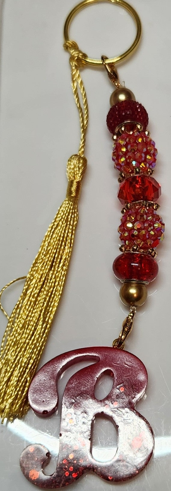 Red & Gold initial key hai